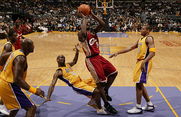 He may be young, but at 6'8", 240 pounds, LeBron James can hold his own in the paint with his elders.